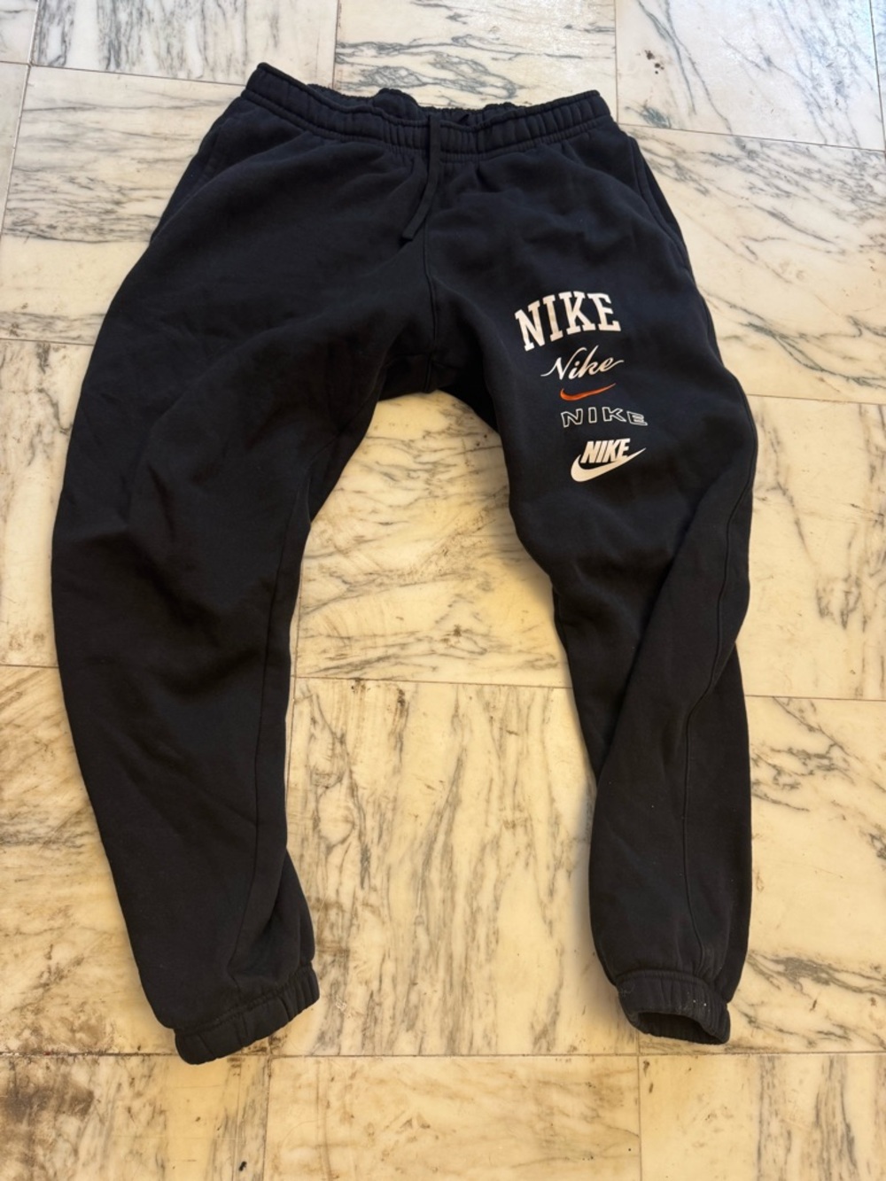 Nike Black Joggers with White and Orange Logo Accents